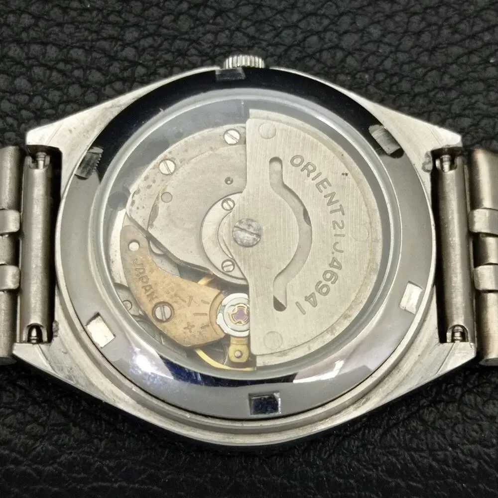 Vintage 1982 Orient Automatic Mens Silver Watch W/daydate & Blue accents